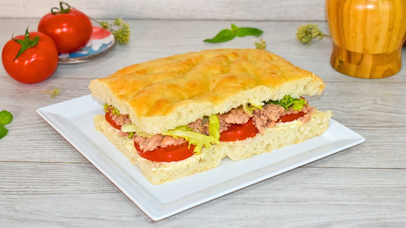 Cut in half and filled with tuna, tomato and lettuce