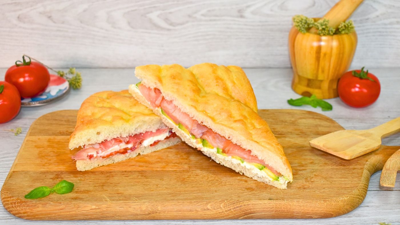 Cut in half and filled with ham, cheese and prosciutto crudo