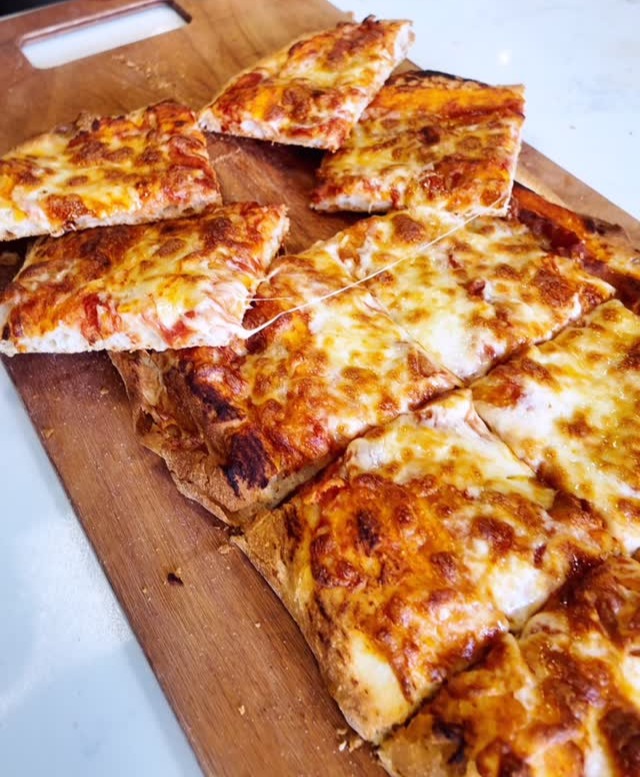 Baked and cut into slices on a wooden board